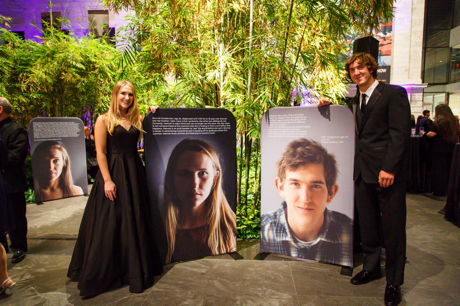 Future Vision Foundation 2021-6 Hannah and Tyler Corderman each stand next to their portrait from the Shine a Light on Usher Syndrome exhibit