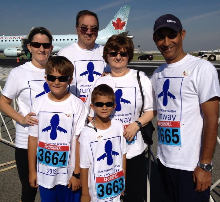 Fran and John Hickmott at the Toronto Pearson Airport Runway Run in 2013 with daughter Pam (far left), son-in-law Carlito (far right), and grandsons Ethan (front left) and Gavin (front center)