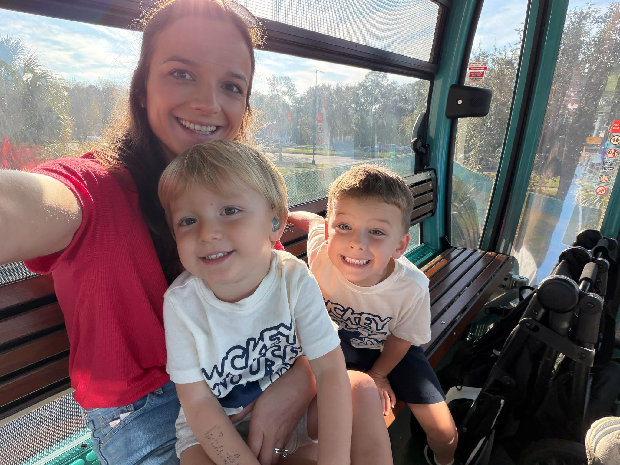 A photo of Michael's wife, Autumn, with Joey and Mikey in a gondola.