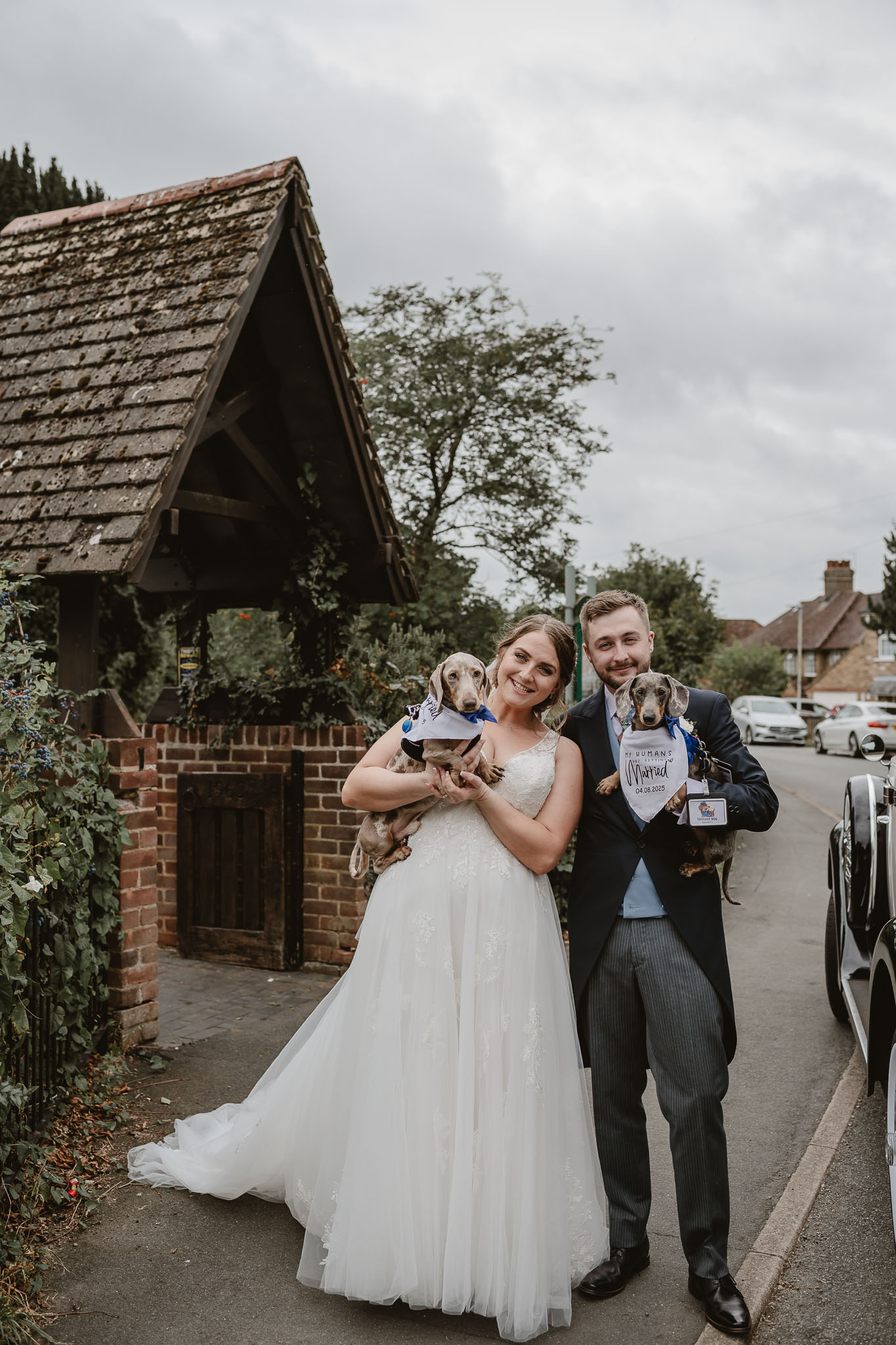 A family photo of Michael Poalise and his wife, holding their two sons. They all wear yellow t-shirts and are outside.