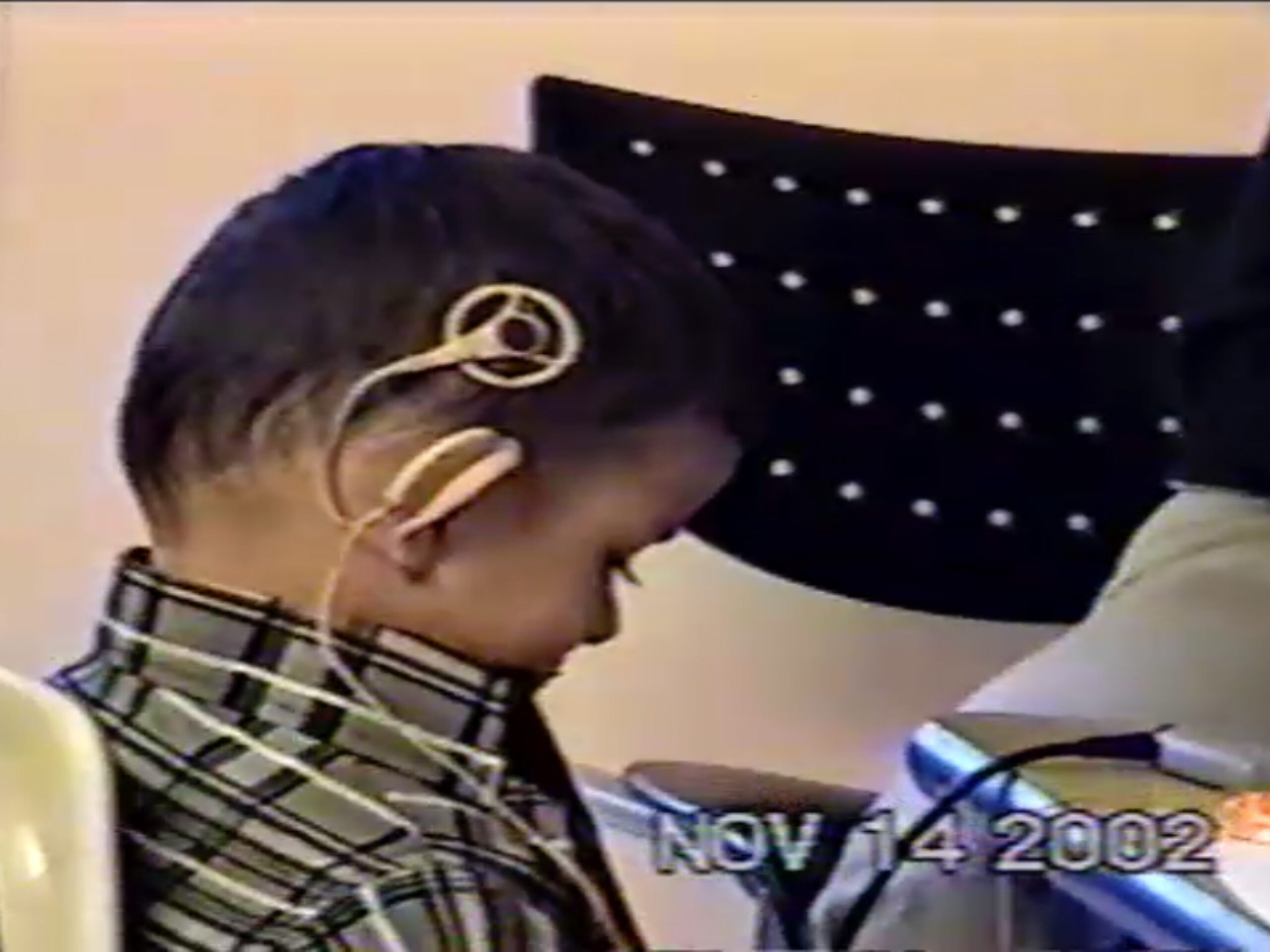 Awais listening to beeps through his right cochlear implant on activation day.