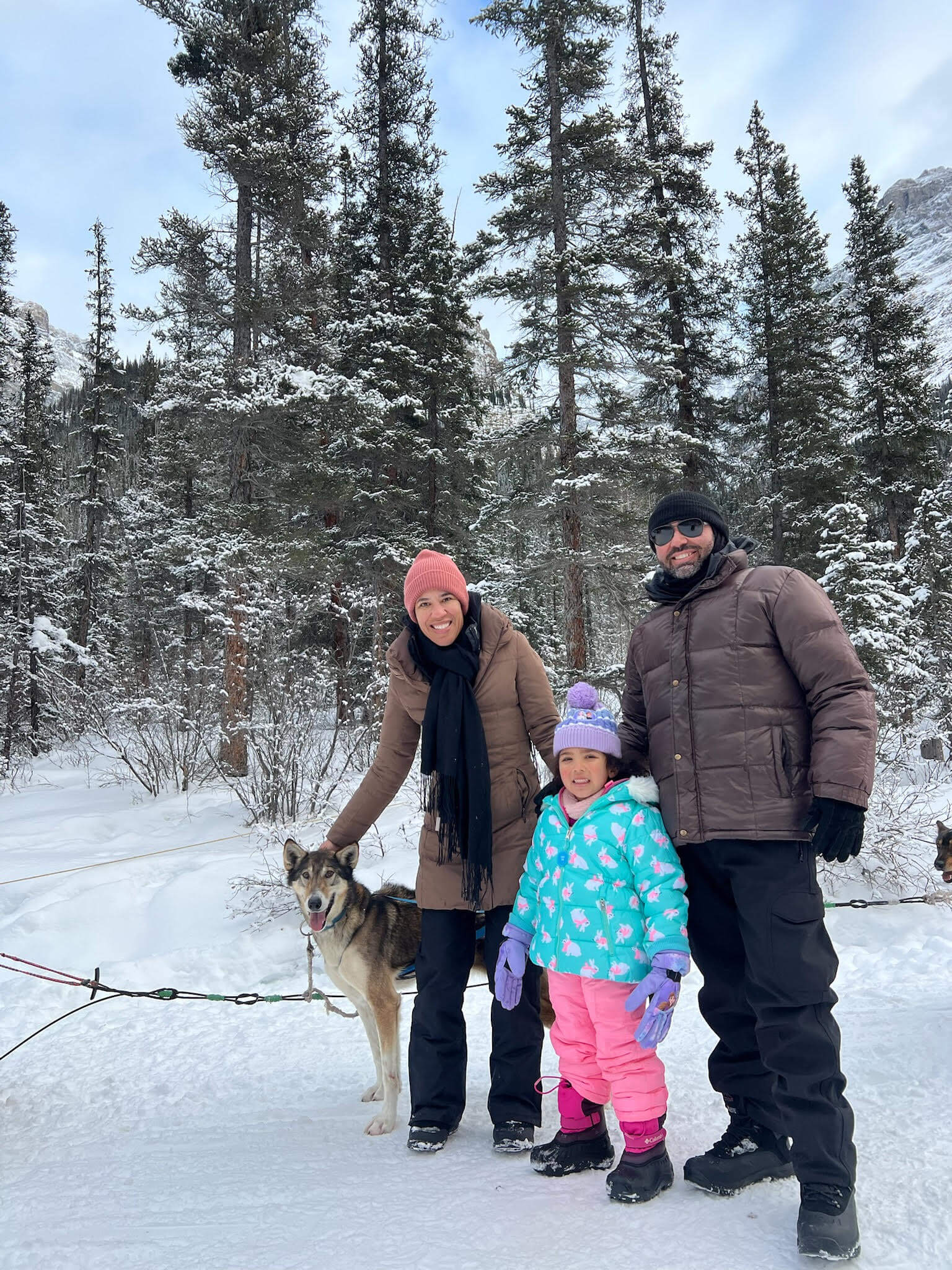 Family picture dogsledding in Banff, Canada 2024
