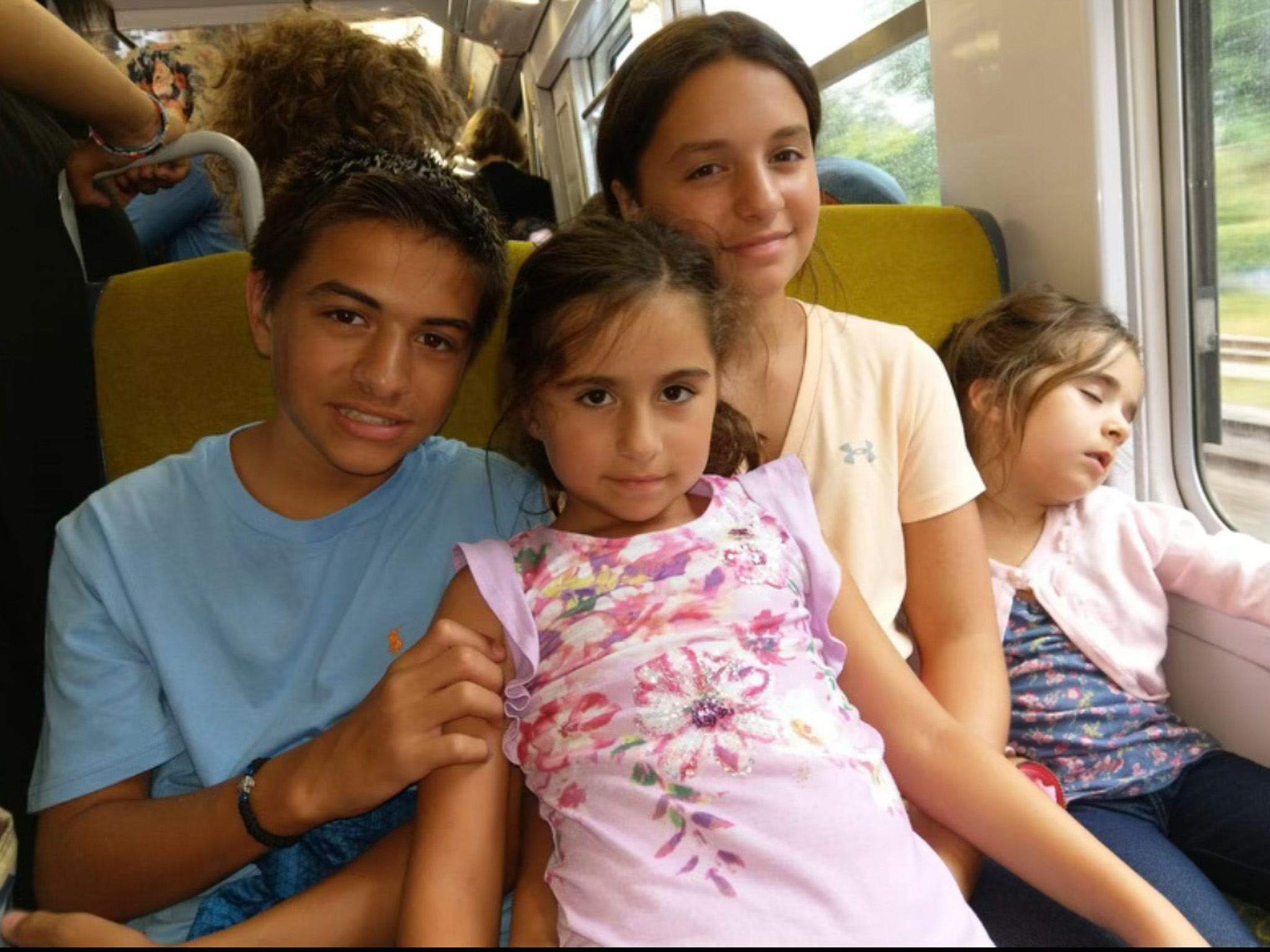 Katerina with her family on a train to Paris on her way to visit the Eiffel Tower.
