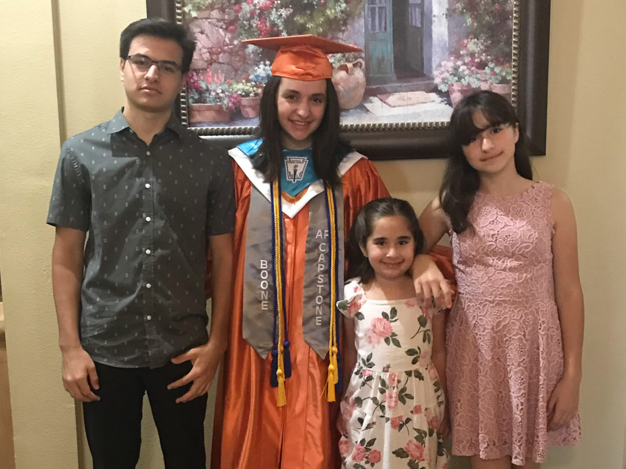 Katerina with her three siblings on her high school graduation day.