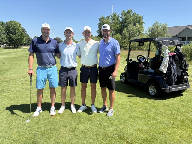 A 4 person team photo at the 2026 Grand Rapids Open - Golf for a Cure