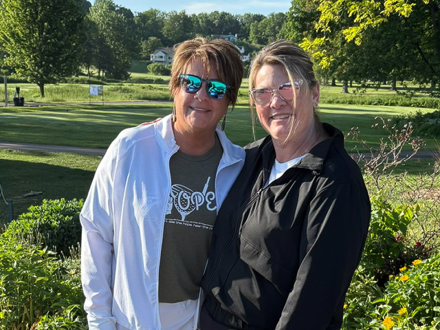 Two woman stand on the golf course at the 2026 Grand Rapids Open - Golf for a Cure