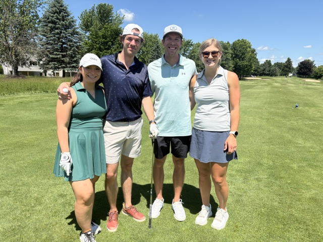 A 4 person team photo at the 2026 Grand Rapids Open - Golf for a Cure