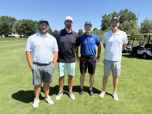 A 4 person team photo at the 2026 Grand Rapids Open - Golf for a Cure