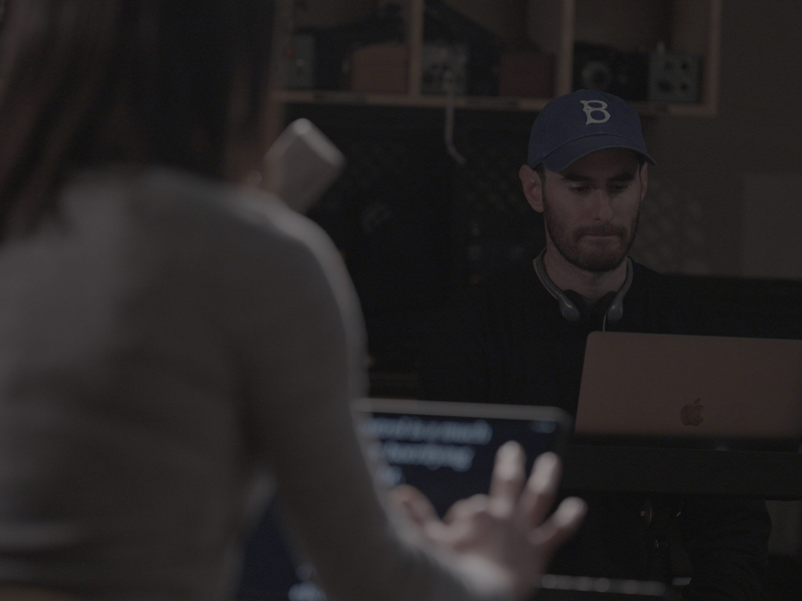 Ryan Porush and Rebecca Alexander work in the studio on their computers during the filming of Not Fade Away.