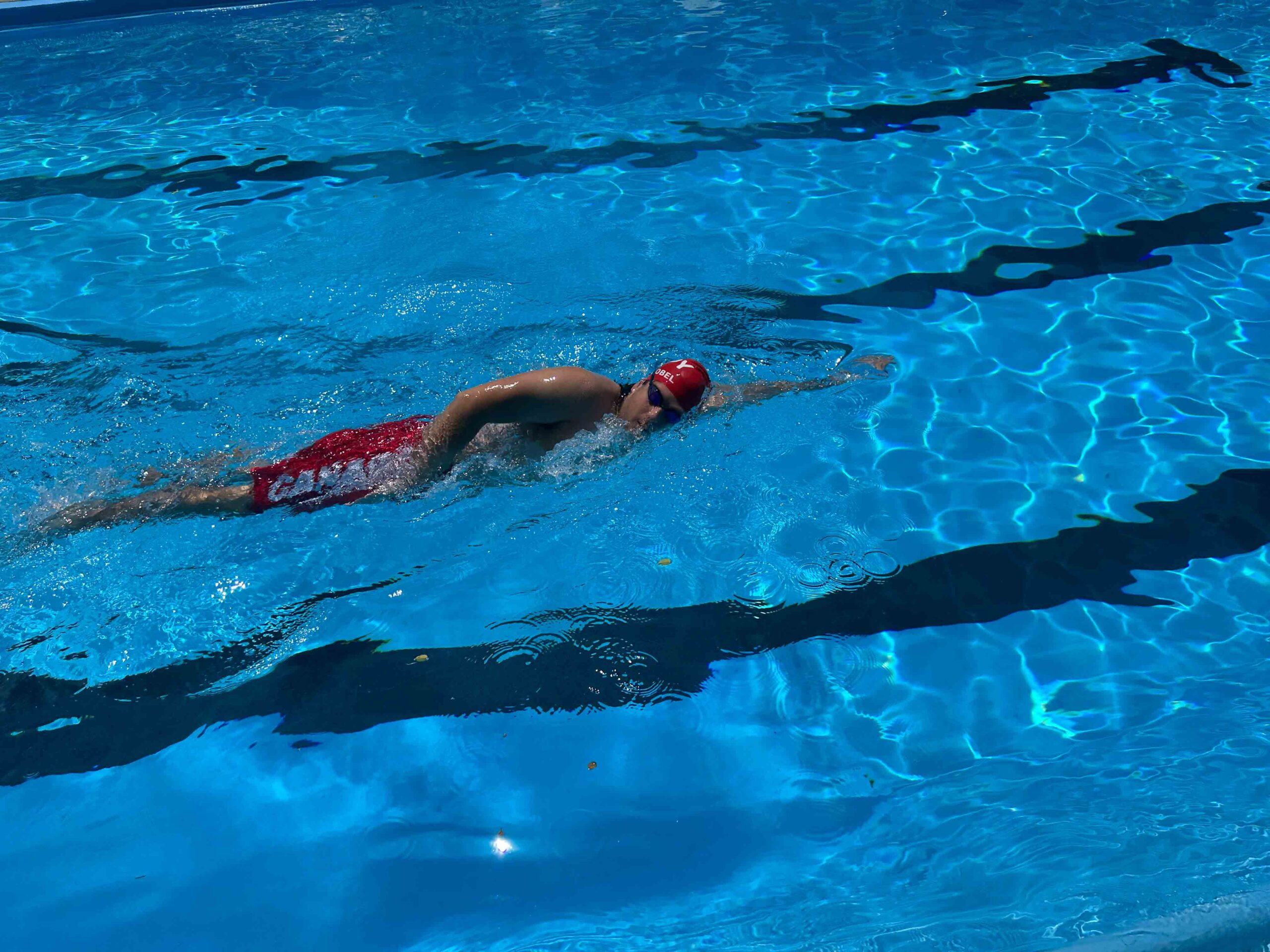 Ethan practicing in an outdoor pool for the USH X Alcatraz Swim