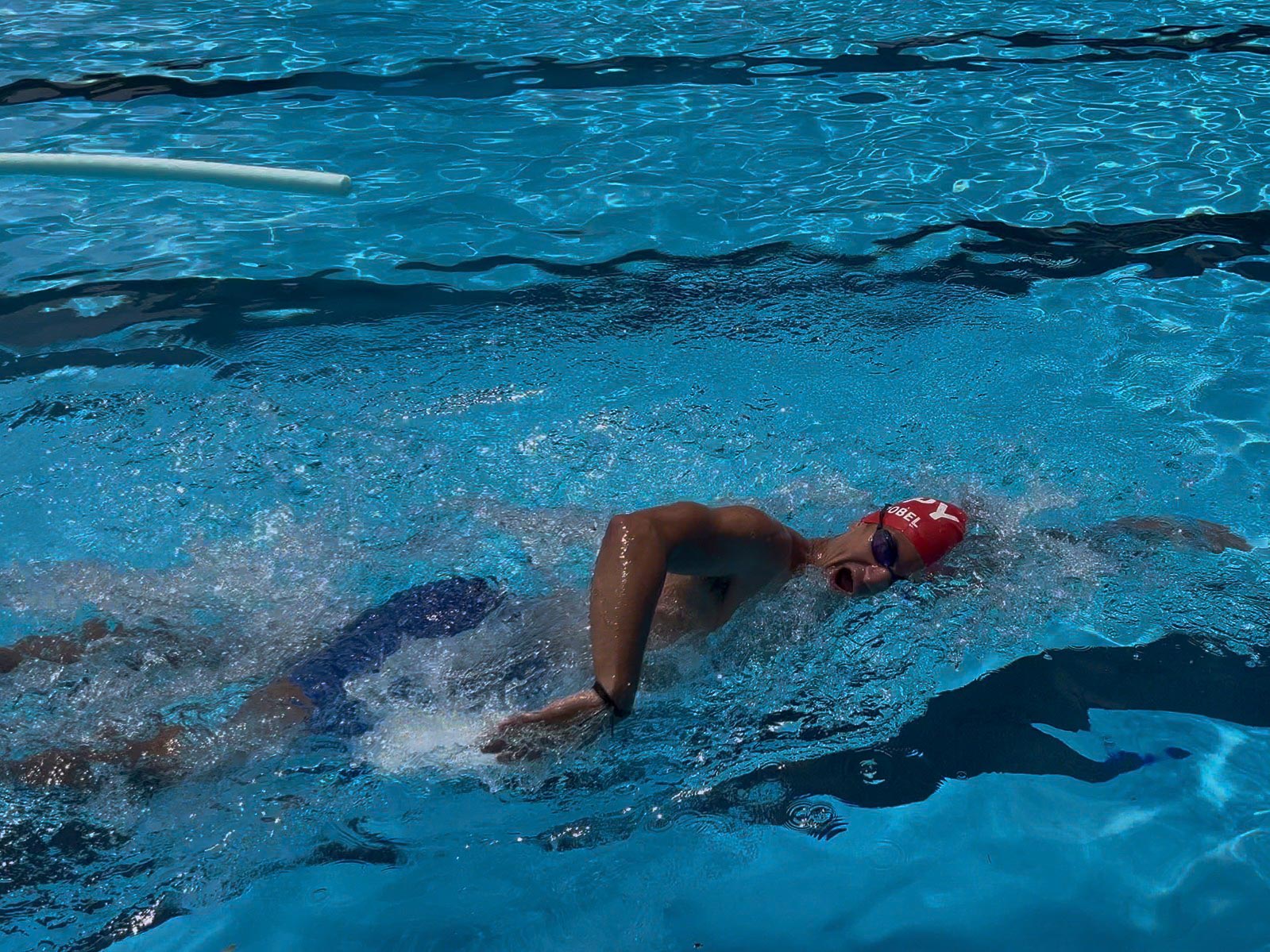 Ethan practicing in an outdoor pool for the USH X Alcatraz Swim